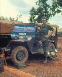 Jim Klug with Chaplain jeep in Vietnam